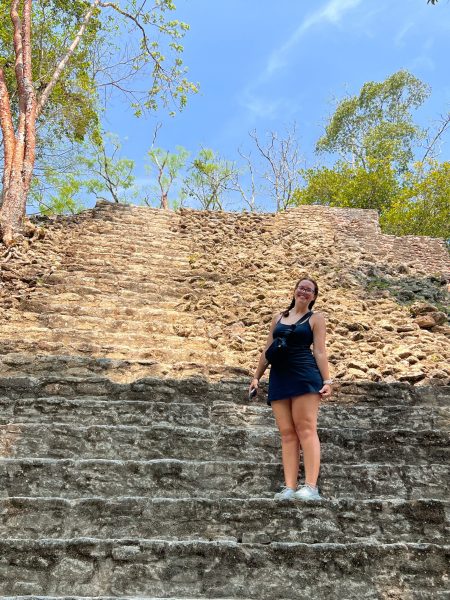 Lindsey Breaux stands at an archaeological site in Belize. Breaux studied abroad in the Central American country to enhance her studies in communication sciences.