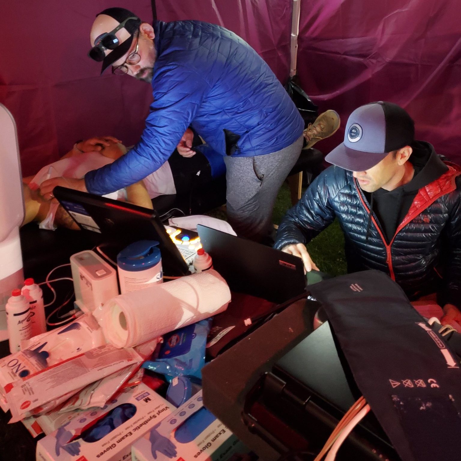 Drs. Grosicki and Babcock (University of Colorado, Anschutz Medical Campus) work through the night to collect cardiovascular measures on race finishers.
